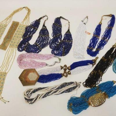 1286	LARGE LOT OF COSTUME JEWELRY NECKLACES INCLUDES 2 NECKLACES W/FOREIGN COINS, AS FOUND
