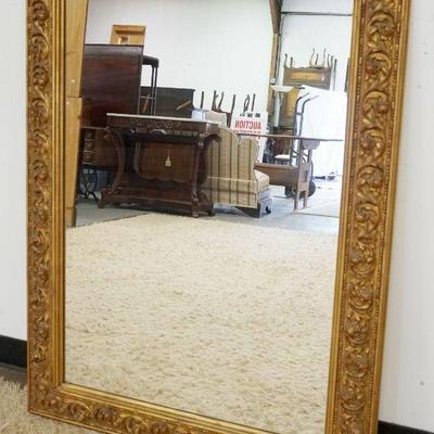 1147	WALL MIRROR IN ORNATE GILT FINISHED FRAME, APPROXIMATELY 36 IN X 48 IN
