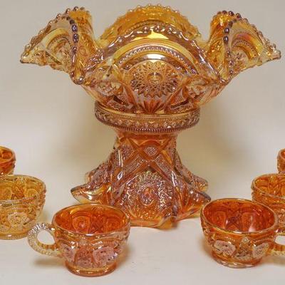 1030	CARNIVAL GLASS PUNCH BOWL W/6 CUPS, SMALL CHIP ON BASE, APPROXIMATELY 10 IN HIGH
