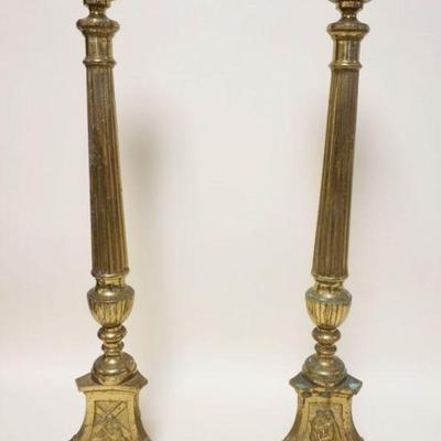1232	PAIR OF LARGE BRASS PAW FOOT COLUMNS WITH RELIGIOUS THEMES ON BASE, APPROXIMATELY 31 IN H
