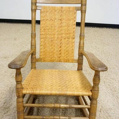 1152	BUMBY CHAIR CO OAK PORCH ROCKER W/WOVEN BACK & SEAT
