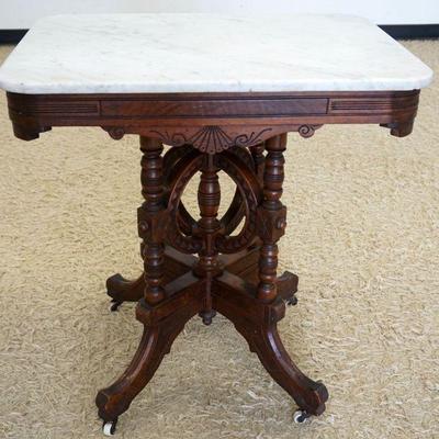 1094	WALNUT VICTORIAN MARBLE TOP TABLE, APPROXIMATELY 20 IN X 28 IN X 30 IN HIGH
