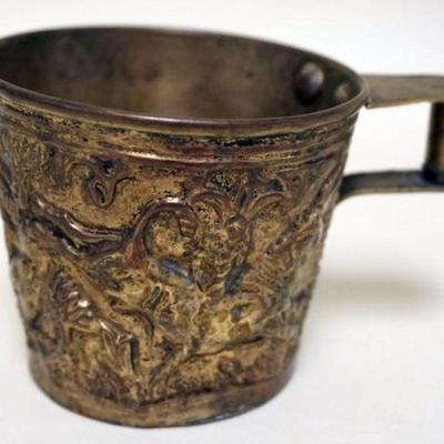 1229	ANTIQUE HANDMADE BRASS EMBOSSED CUP WITH IMAGES OF BUCKING BULL AND STEER, APPROXIMATELY 3 IN H
