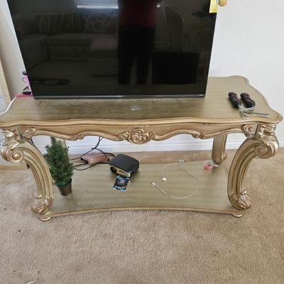 Gold Detailed Console Table and television