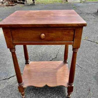 Lot 013-G: Antique Side Table

Features:
â€¢	Solid wood, with one drawer and lower shelf

Dimensions: 21â€W x 16â€D x 30â€H...
