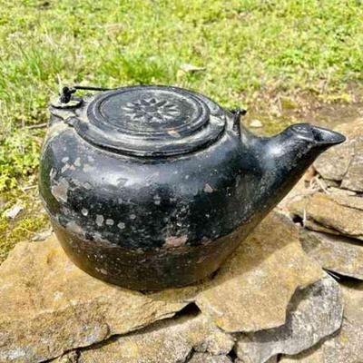 Lot 132-G: Antique 1800s Cast Iron No. 8 Tea Kettle

Features: 
â€¢	This piece has brewed many cups of tea over a wood-burning stove!
â€¢...