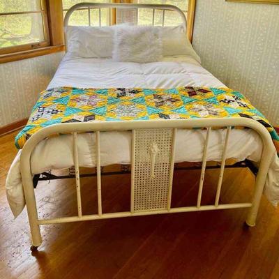 Lot 081-BR1: Antique Bed (bedding not included)

Features: 
â€¢	Antique metal double bed headboard/frame on wheels with metal caning and...