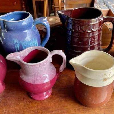Lot 137-G: Vintage Pitcher Collection

Features: 
â€¢	Seven colorful earthenware pitchers
â€¢	Various styles and shapes


Dimensions:
â€¢...