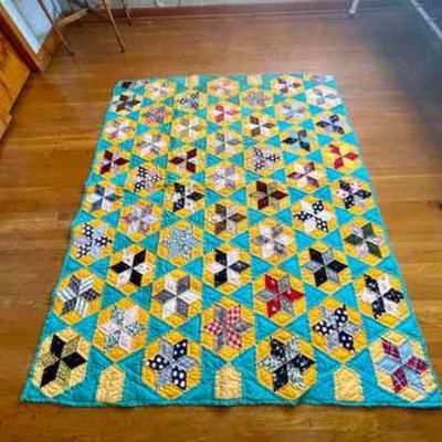 Lot 088-BR1: Quilt #5

Features: 
â€¢	Colors: Multi-colored with turquoise background and turquoise backing
â€¢	Pattern: Six Pointed...