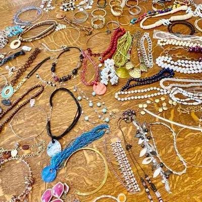 Lot 142-J: Costume Necklaces and Bracelets

Features: A large eclectic collection of costume necklaces and bracelets. Please refer to...