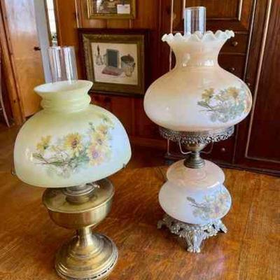 Lot 102-BR1: Electrified Lamp Pair #4

Features: 
â€¢	Two electrified oil lamps with hand-painted yellow floral patterns on cream...