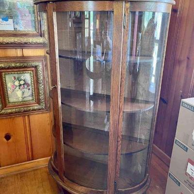 Lot 077-LR: Curved-Glass Front Curio

Features: 
â€¢	Key included (the door doesnâ€™t lock, however)


Dimensions: 33â€W x 57â€H x...