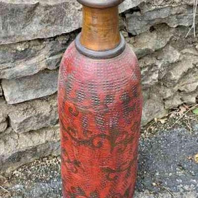 Lot 135-G: Tall Red Vase

Features: Ceramic vase with striated exterior, sangria-red paint, black floral background design, no markings....