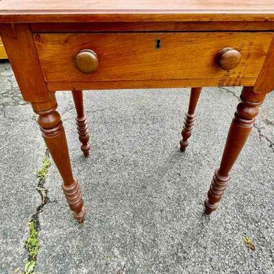 Lot 020-G: Antique Side Table

Features:
â€¢	One drawer 
â€¢	Skeleton key is missing

Dimensions: 24â€W x 17â€D x 31â€H


Condition:...