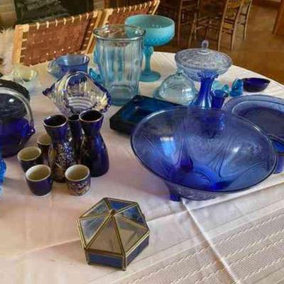 Lot 069-LR: Blue Glass Lot

Features: 
â€¢	32 assorted pieces
â€¢	Includes a Sake serving set

Dimensions: 

Condition:
â€¢	Good...