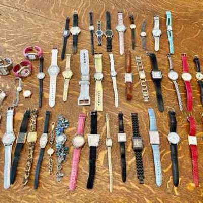 Lot 143-J: Fashion Watches

Features: A large collection of womenâ€™s fashion watches. Most are contemporary; a few border on vintage....