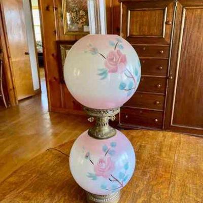 Lot 103-BR1: Double-Globe Electrified Lamp

Features: 
â€¢	Electrified antique oil lamp featuring two hand-painted globes
â€¢	Globe base...