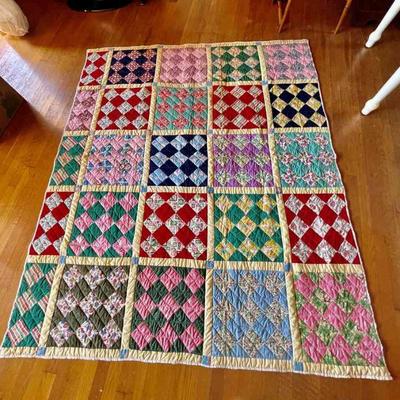 Lot 114-BR1: Quilt #9

Features: 
â€¢	Colors: Multi-colored square sections each featuring nine-multicolored diamonds
â€¢	Economy-style...