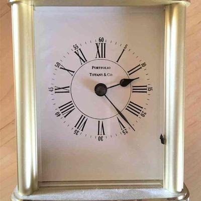 Lot 126-K: Tiffany & Co. Brass Presentation Desk Clock

Features: 
â€¢	Polished brass, compact timepiece
â€¢	No inscription on top or...