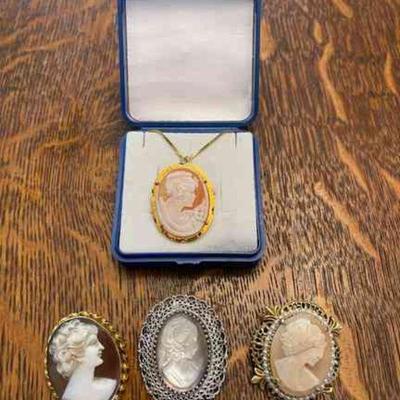 Lot 150-J: Vintage Cameo Collection

Features: 
â€¢	Four vintage cameos
â€¢	Includes boxed Cellini cameo with gold-filled chain...