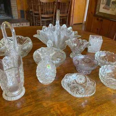 Lot 066-LR: Clear Glass/Cut Glass Assortment

Features: 
â€¢	12 pieces
â€¢	Assortment of glass baskets, serving dishes, vases, and bowls...