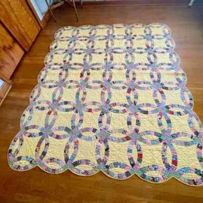 Lot 089-BR1: Quilt #6

Features: 
â€¢	Colors: Multi-color with pastel yellow background and bright yellow backing
â€¢	Pattern: Double...
