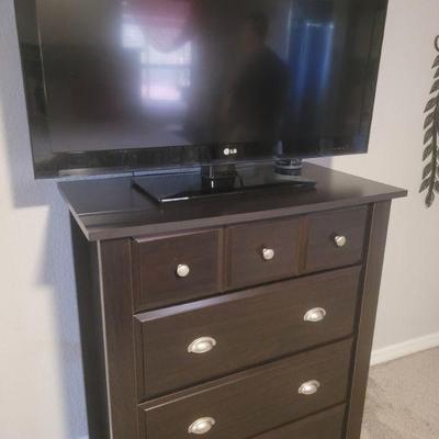 Chest of drawers and another TV