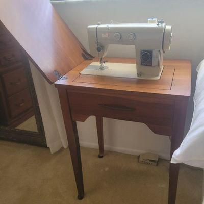 Vintage sewing machine and cabinet