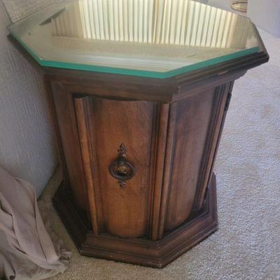 Wooden end table with a glass top