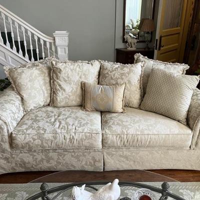 rolled arm sofa with ivory upholstery 