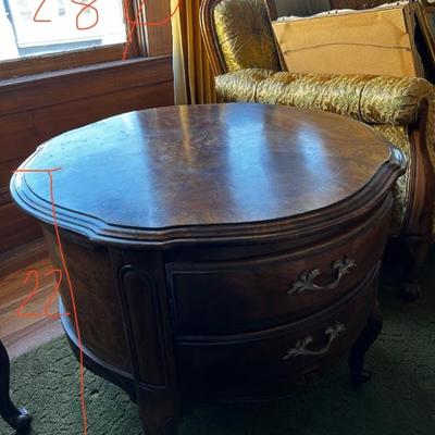 A pair of round end tables