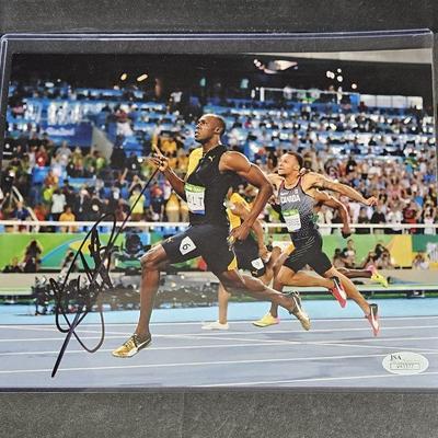SIGNED 8 x 10 Color Photo of USAIN BOLT From Jamaica ~ Running - JSA Certified.  Very good condition