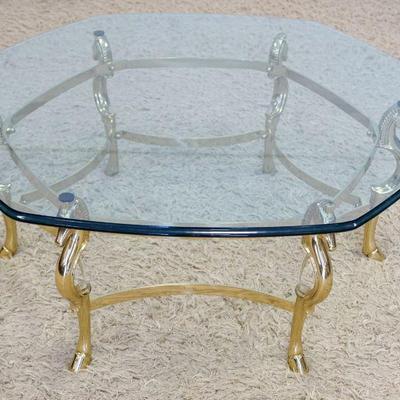 1100	LABARGE STYLE BRASS & GLASS COCKTAIL TABLE W/SEA HORSE LEGS, APPROXIMATELY 40 IN X 16 IN HIGH
