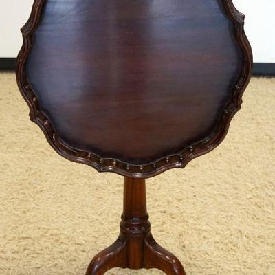 1110	MAHOGANY TILT TOP TABLE W/GALLERY AROUND TOP, APPROXIMATELY 21 IN X 29 IN HIGH
