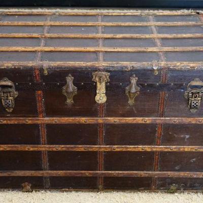 1103	ANTIQUE TRUNK W/WOOD SLAT TRIM & KEY FOR LOCK & INTERIOR TRAYS, APPROXIMATELY 42 IN X 24 IN X 28 IN HIGH
