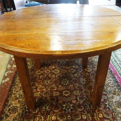 1134	SOLID OAK ROUND PUB TABLE W/2 LEAVES, APPROXIMATELY 47 IN X 30 IN HIGH, LEAVES APPROXIMATELY 16 IN WIDE
