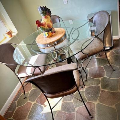 Industrial-style metal and glass breakfast table and four chairs