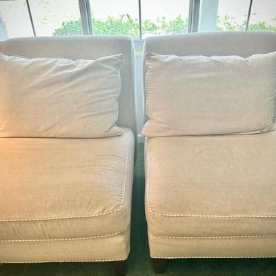 Tan coastal-style armless chairs with tan and white cording (sofa, armchair, and two chairs are all recently upholstered in coordinating...