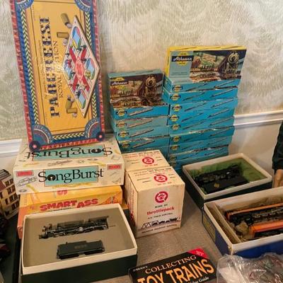 LOTS OF ATHEARN MODEL TRAINS! MOSTLY CARS AND SCALE BUILDINGS... ALSO, GAMES NEW IN BOXES!