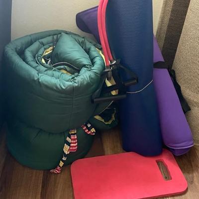sleeping bag, yoga mat, and knee pad