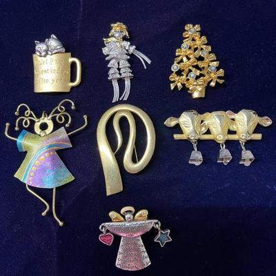 assortment of brooches