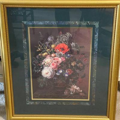 pair of gold framed floral pictures