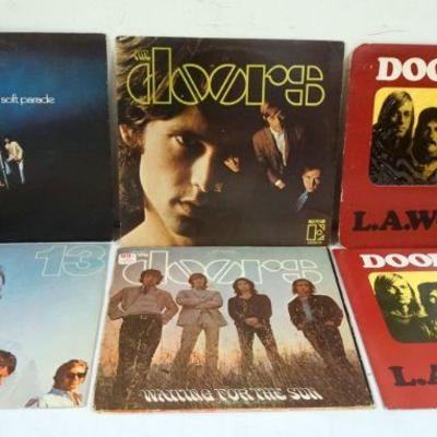 1033	LOT OF 6 THE DOORS VINYL ALBUMS INCLUDES LA WOMAN, 13, WAITING FOR THE SUN, SELF TITLED, & THE SOFT PARADE

