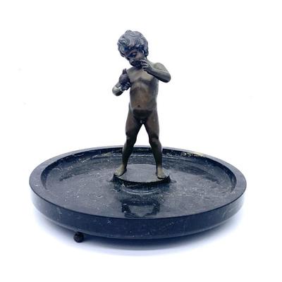 Antique bronze boy holding bird on round marble base, base 12 in. diameter