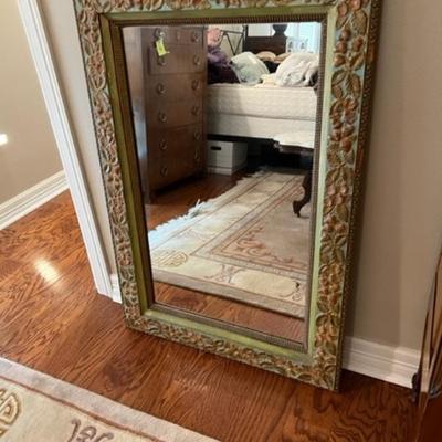 Beveled mirror in metal frame