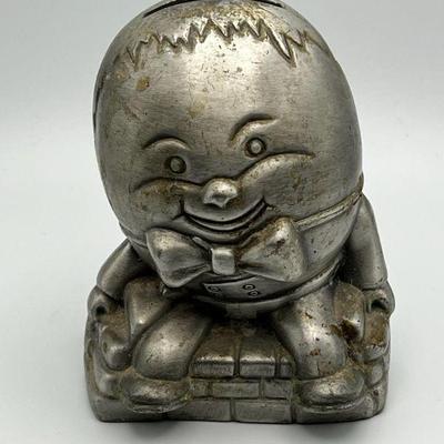 Metal Humpty Dumpty Bank With Coins
