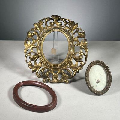 (3PC) OVAL PICTURE FRAMS | Includes: 1 large gilt metal picture frame with scrolled wreath border, one small 19th century French frame...