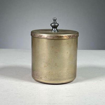 KENNETH LYNCH & SONS CONTAINER | Small metal container with jousting knight stamped in top.