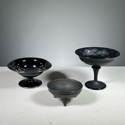 (3PC) ASSORTED BLACK BOWLS | Various black glass and ceramic bowls, including two compotes and a molcajete. Dimensions: h. 6.5 x dia. 6.5 in