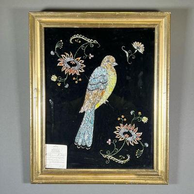 19TH C. TINSEL WORK | Victorian tinsel work of a bird among flowers in a gilded frame.